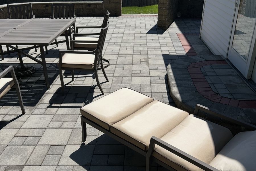 Cleaned patio furniture on a paver patio